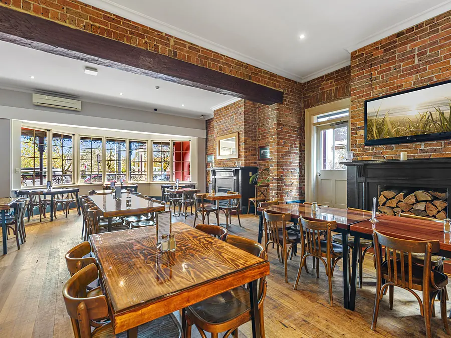 Moss Vale Hotel dining room with timber tables and brick walls