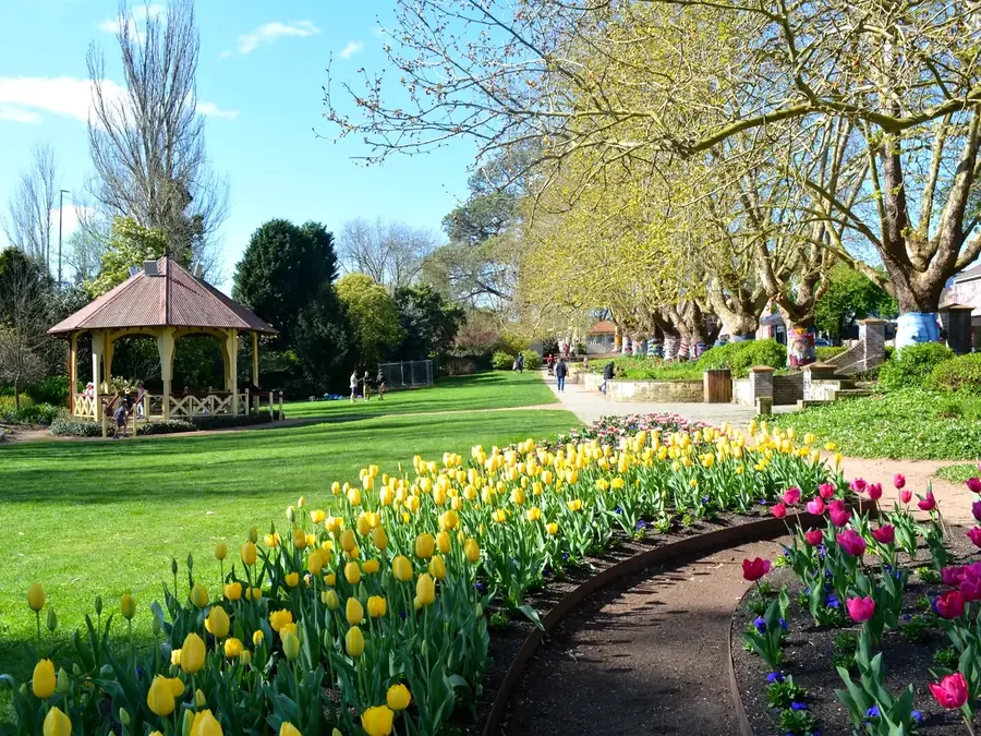Leighton Gardens path, lawns, and spring tulips